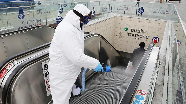 An-agent-disinfecting-the-subway-entrance-to-Taksim-Square-in-Istanbul